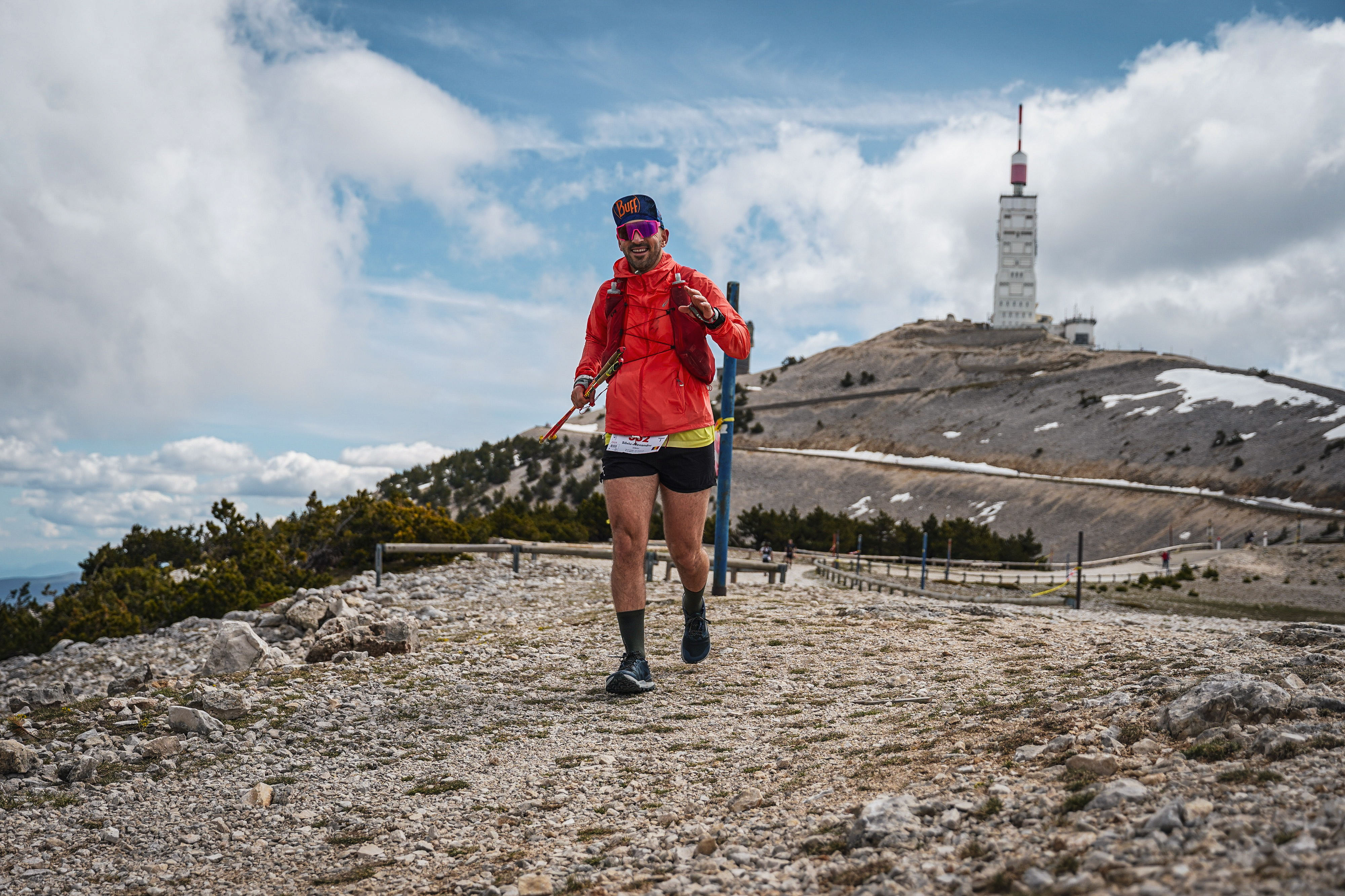 Trail runner ascending a mountain peak